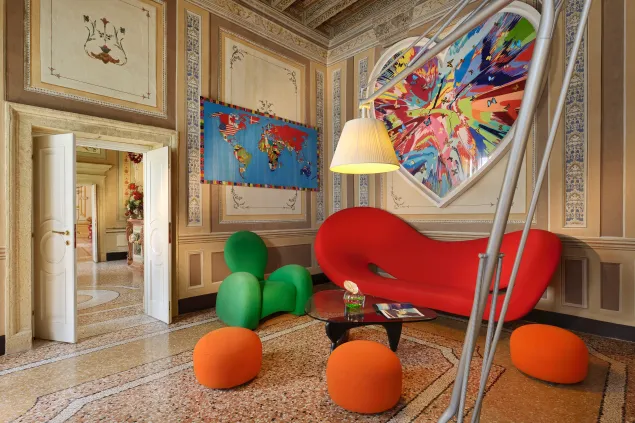 Hotel courtyard with a hung work on a plain wall