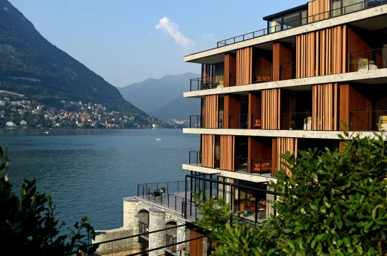 Modern lakeside hotel with stepped terraces facing the water
