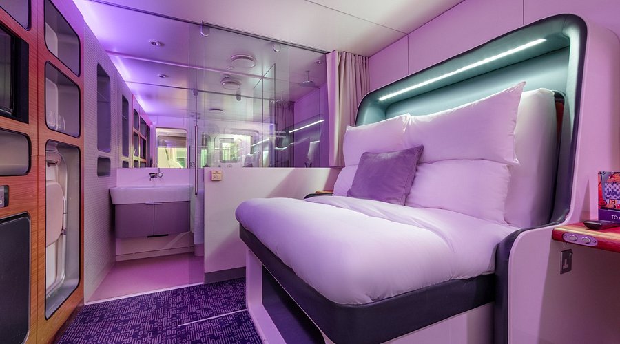 Compact airport cabin with folding bed and adjustable lighting